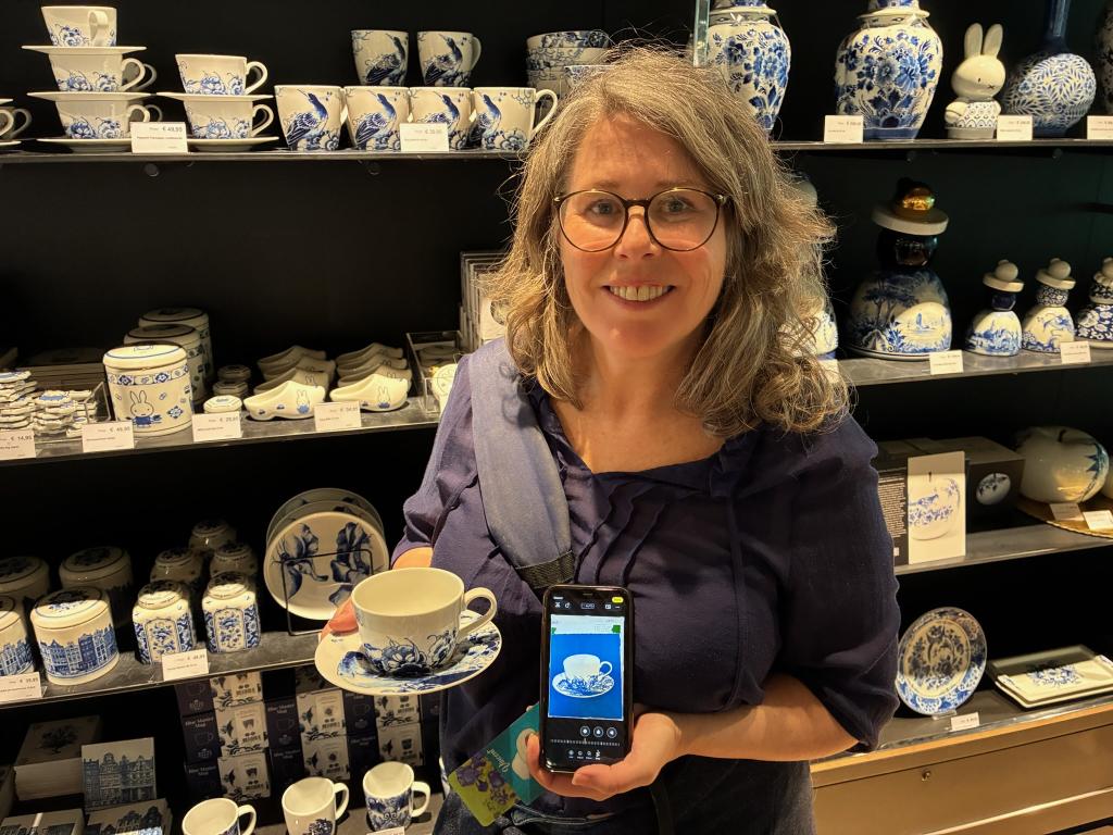 A photo of me holding a Delft coffee cup.