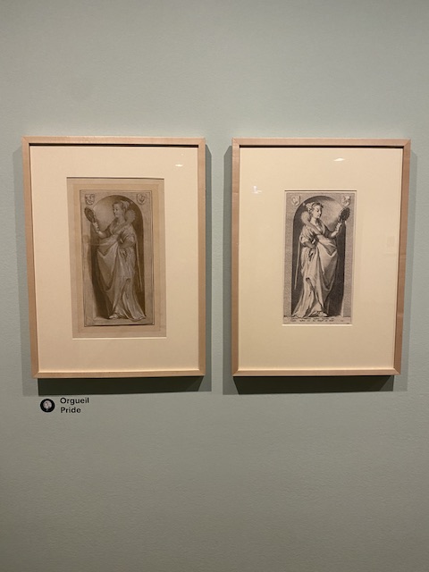 Image of framed drawing and framed print of a woman. 