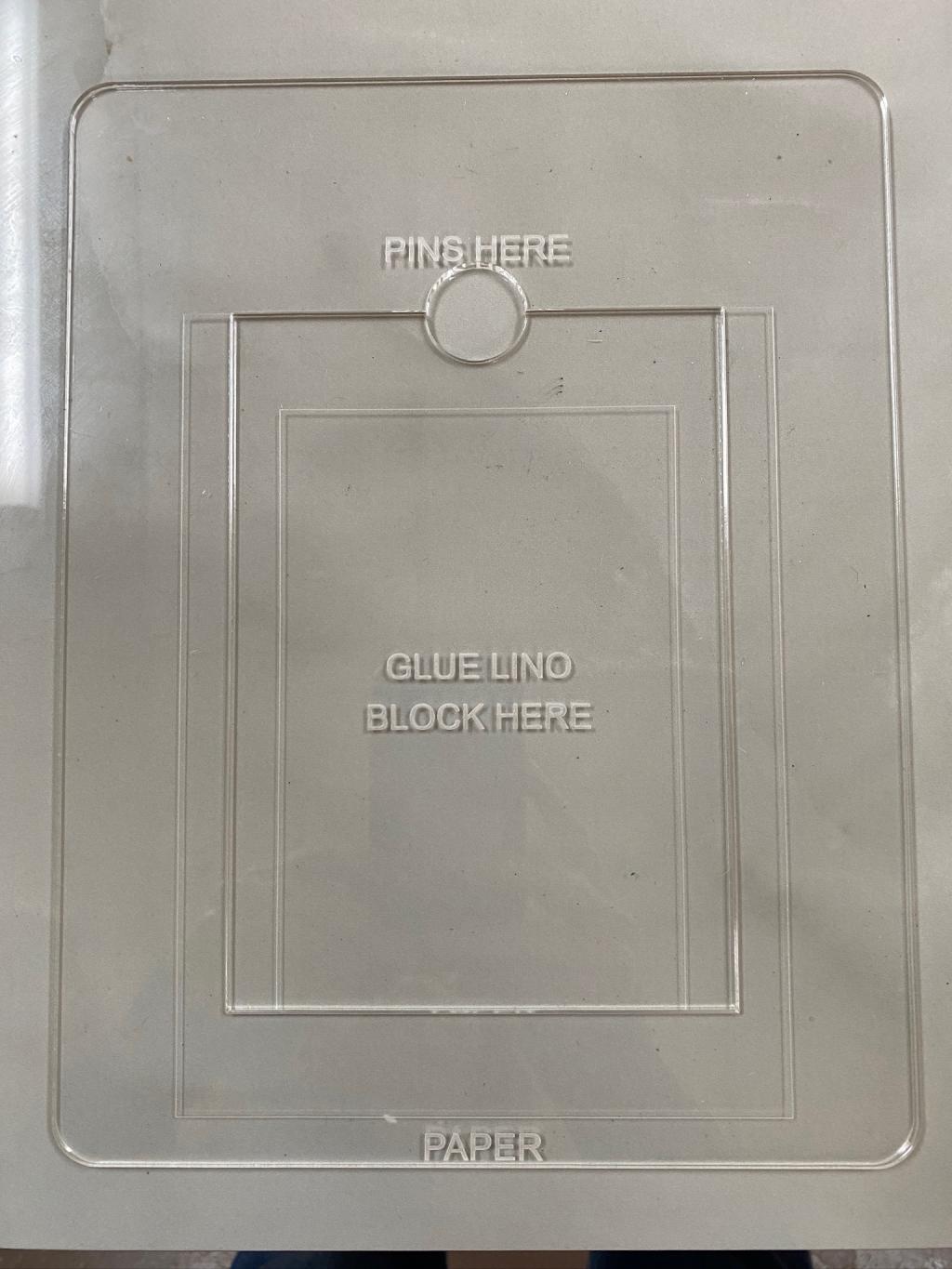 An acrylic "jig" sitting on a table.