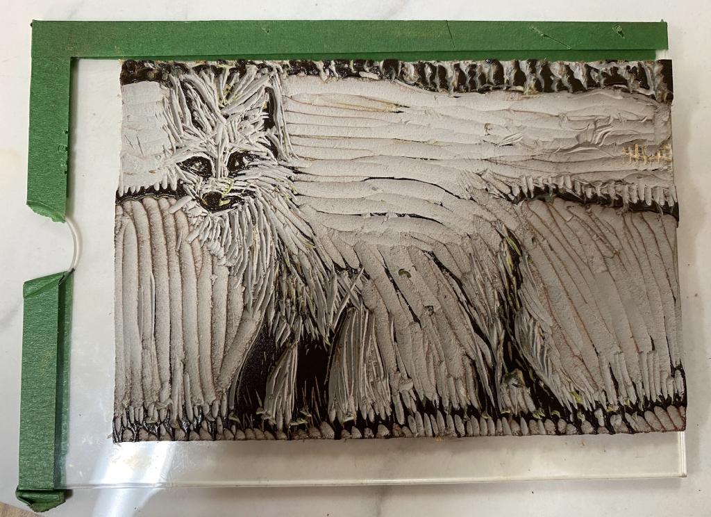 The "finished" block, inked in black. Most of the block is carved away.