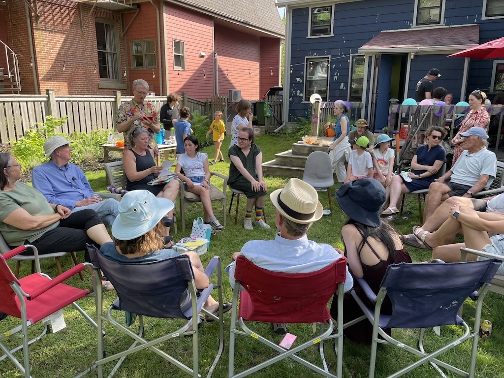 The crowd at my birthday party, gathered in a circle of chairs in the back yard.