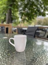 Photo of a coffee cup on a table 