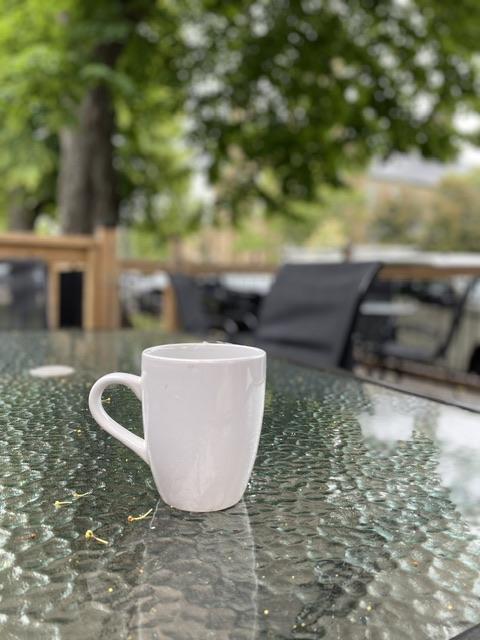 Photo of a coffee cup on a table 